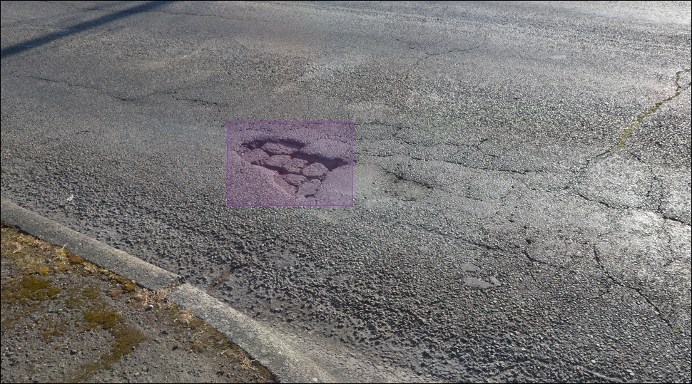 An image of a roadway in Tacoma (Sprague Avenue) with a highlighted pothole shaded in purple